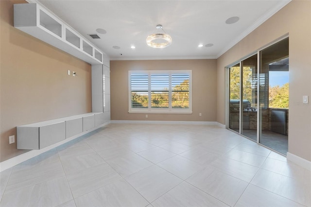 tiled empty room featuring crown molding and a wealth of natural light