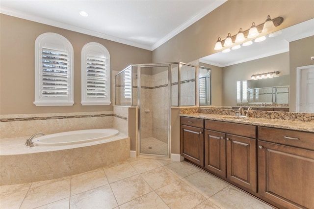 bathroom with crown molding, tile patterned floors, shower with separate bathtub, and vanity