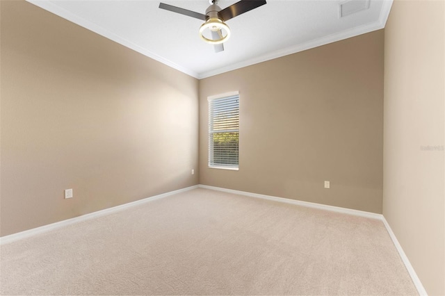 empty room featuring ceiling fan, ornamental molding, and carpet