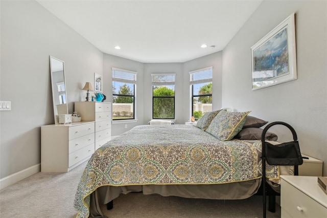 bedroom featuring recessed lighting, baseboards, and light carpet