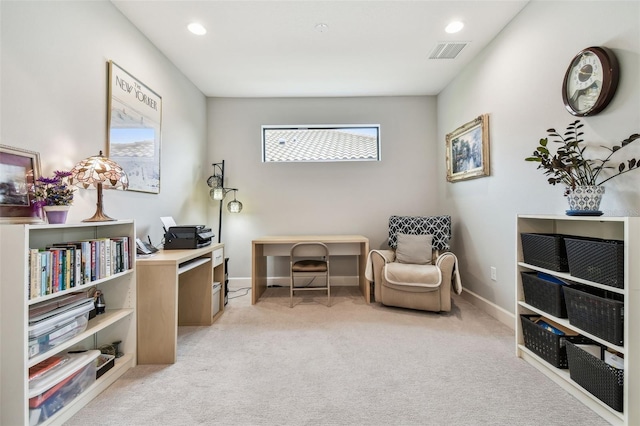 sitting room with light colored carpet