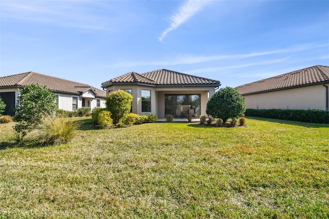 rear view of house with a lawn