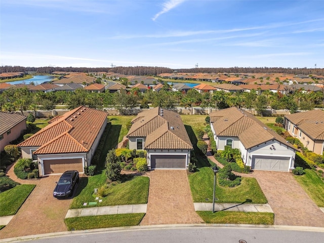 birds eye view of property featuring a residential view and a water view