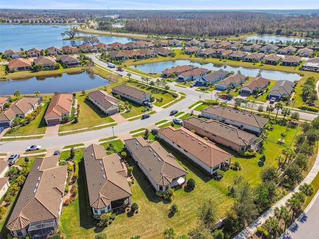 bird's eye view with a residential view and a water view