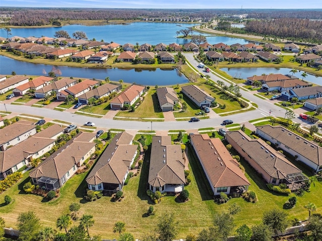 aerial view featuring a residential view and a water view