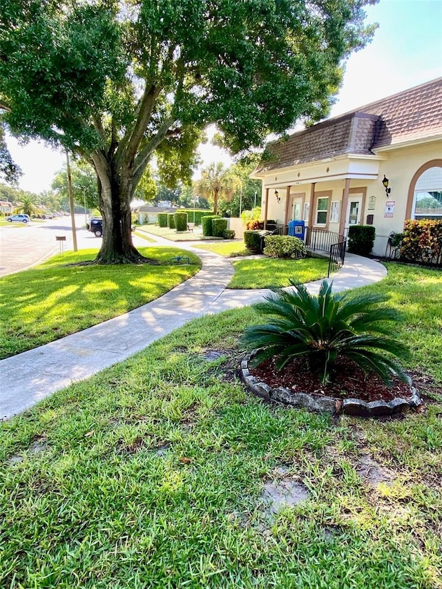 view of yard with covered porch