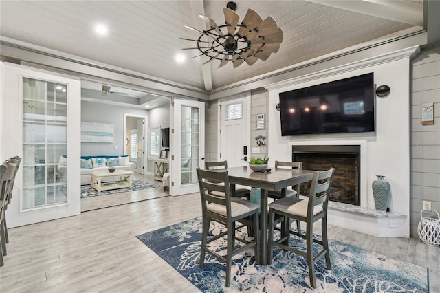 dining space featuring ornamental molding, hardwood / wood-style floors, wood ceiling, and french doors