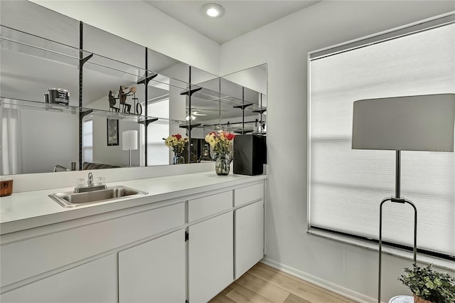 bathroom featuring vanity and wood-type flooring