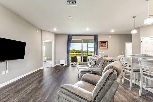 living room featuring dark wood-type flooring