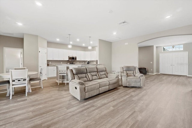 living room with light hardwood / wood-style floors