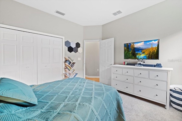 carpeted bedroom featuring a closet