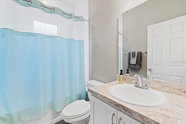 full bathroom with shower / bathtub combination with curtain, vanity, and toilet