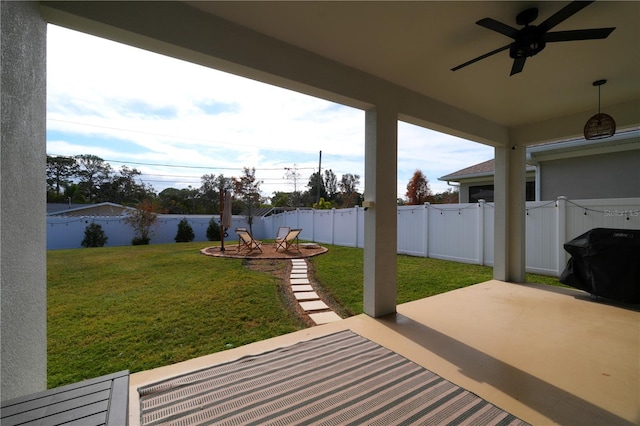 view of patio with a grill and ceiling fan