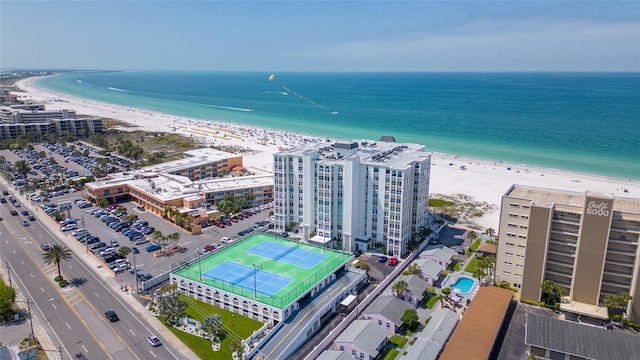 bird's eye view featuring a view of the beach and a water view