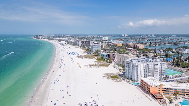 birds eye view of property with a view of the beach and a water view