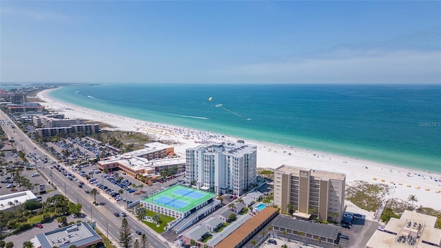 drone / aerial view with a beach view and a water view