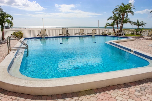 view of swimming pool with a patio area