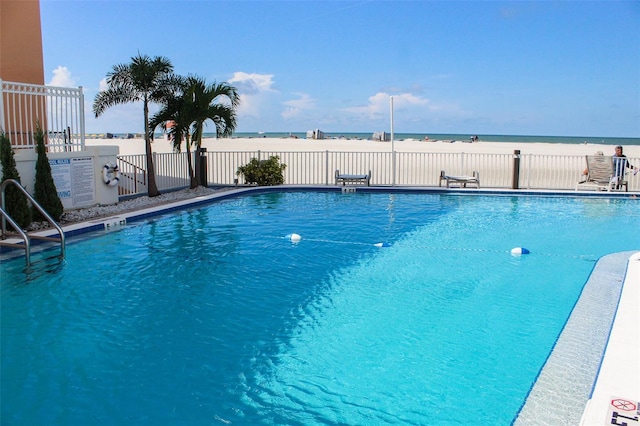 view of pool with a water view