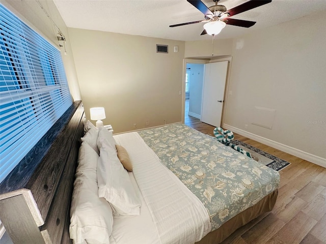 bedroom featuring ceiling fan and wood-type flooring