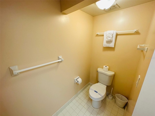 bathroom featuring tile patterned flooring and toilet