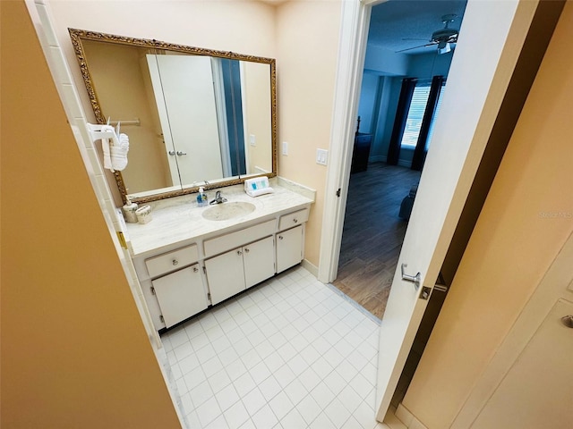 bathroom featuring vanity and ceiling fan