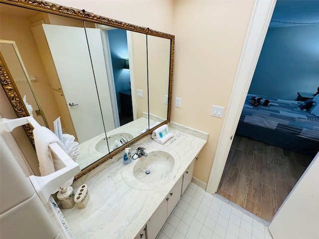 bathroom with hardwood / wood-style flooring and vanity