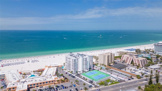 birds eye view of property with a beach view and a water view