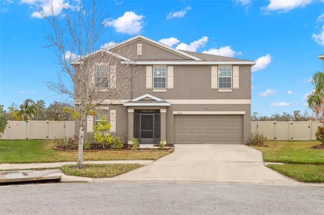 front facade with a garage and a front yard