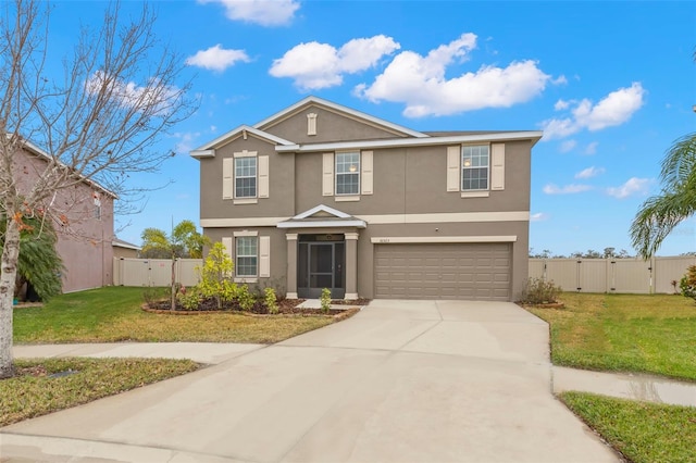 front facade featuring a garage and a front lawn