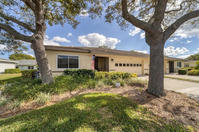 ranch-style home featuring a garage