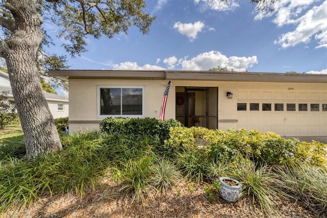 single story home featuring a garage