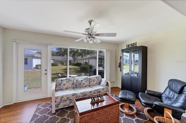 sunroom / solarium featuring ceiling fan