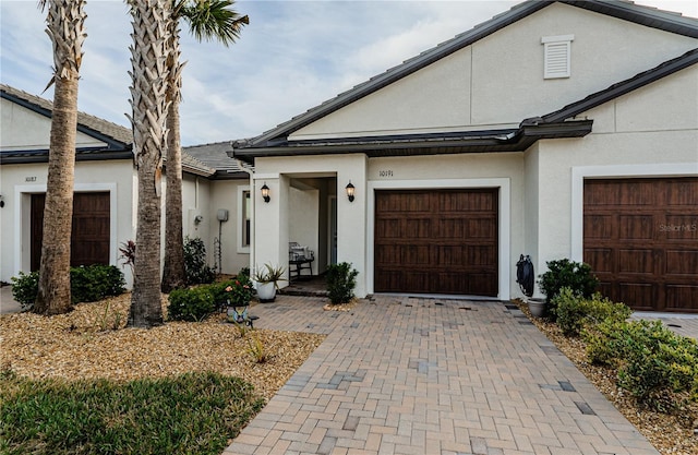 ranch-style house featuring a garage