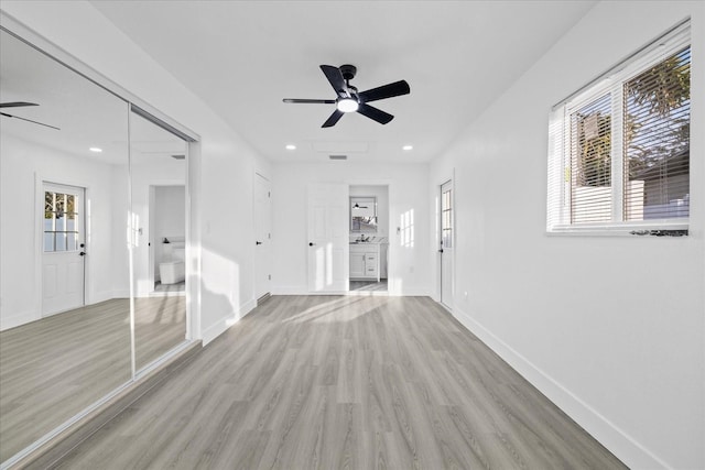 interior space featuring light hardwood / wood-style flooring and ceiling fan