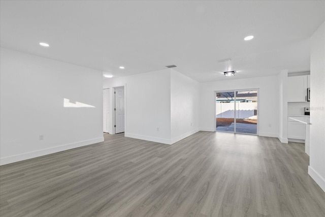 unfurnished living room featuring light wood-type flooring