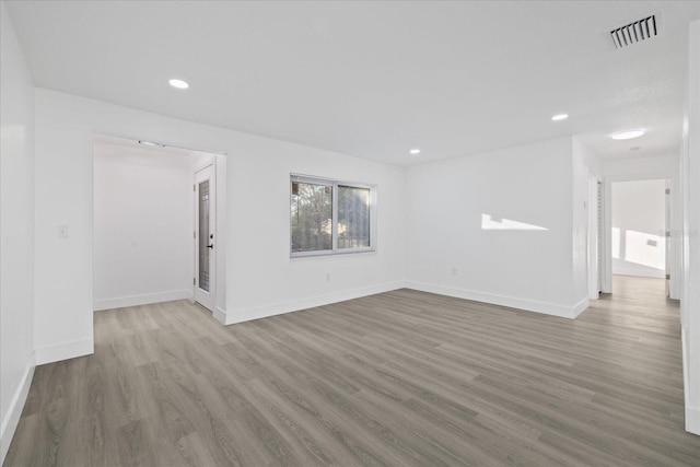 spare room with light hardwood / wood-style floors