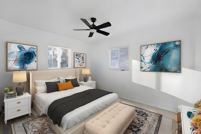 bedroom featuring hardwood / wood-style floors and ceiling fan