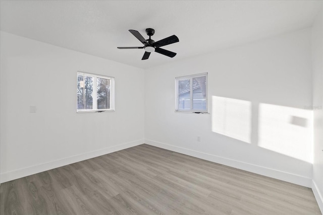 unfurnished room featuring ceiling fan and light hardwood / wood-style floors