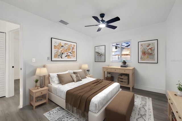 bedroom featuring dark hardwood / wood-style flooring and ceiling fan