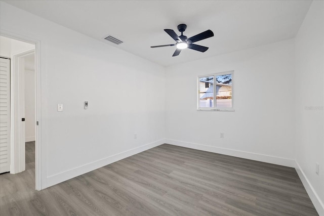 spare room featuring hardwood / wood-style flooring and ceiling fan