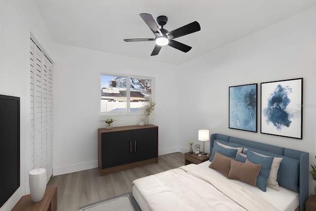 bedroom featuring hardwood / wood-style flooring and ceiling fan