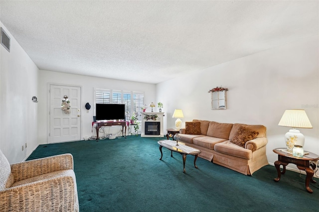 carpeted living room featuring a textured ceiling