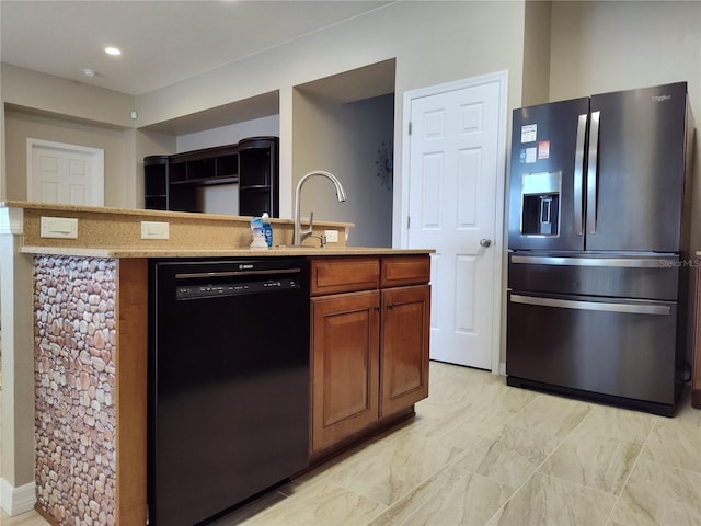 kitchen with brown cabinetry, dishwasher, stainless steel fridge with ice dispenser, a sink, and recessed lighting