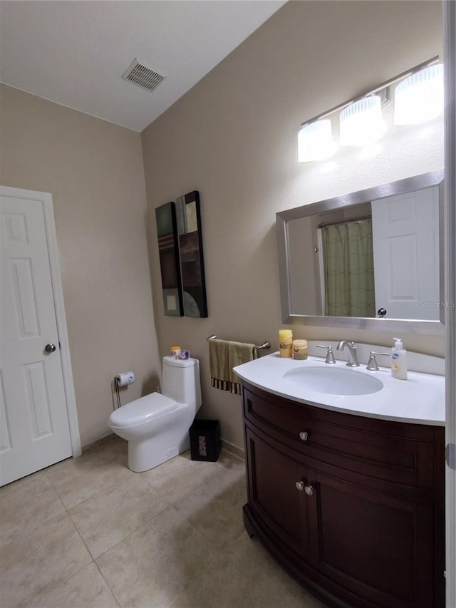 full bathroom featuring tile patterned flooring, visible vents, vanity, and toilet