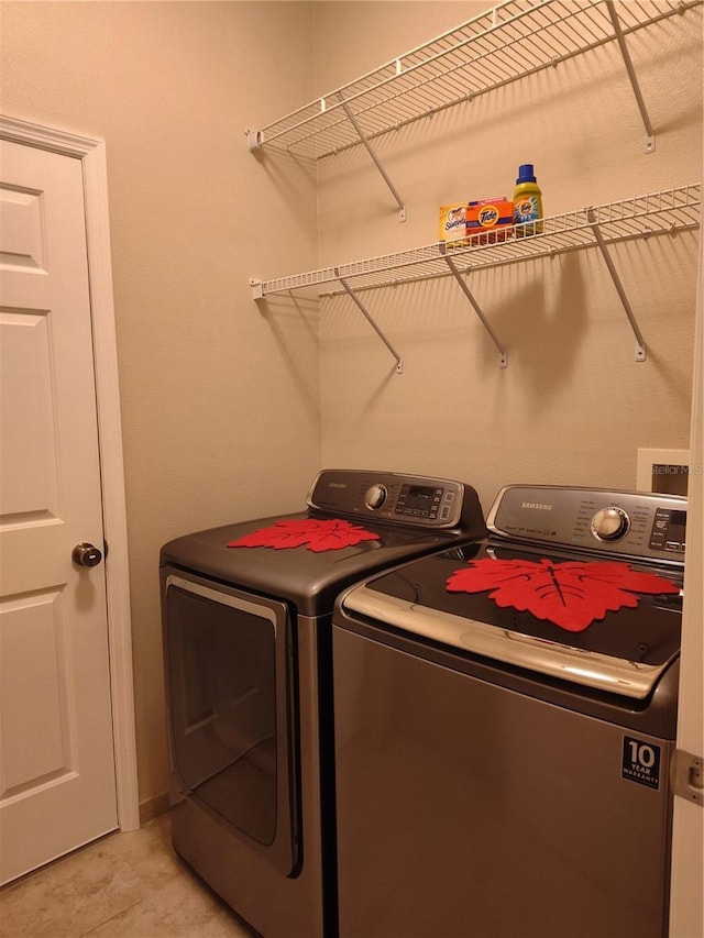 clothes washing area with laundry area and independent washer and dryer