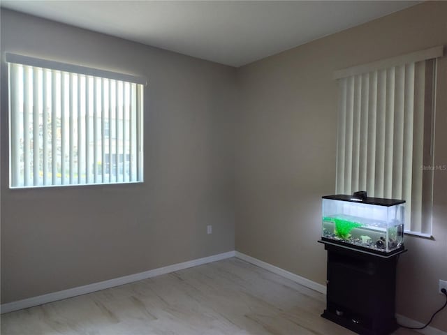 empty room featuring baseboards