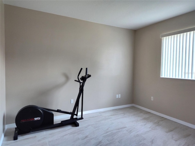 workout room with baseboards