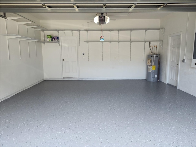 garage with a garage door opener and electric water heater