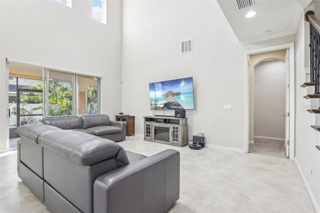 living room with a towering ceiling