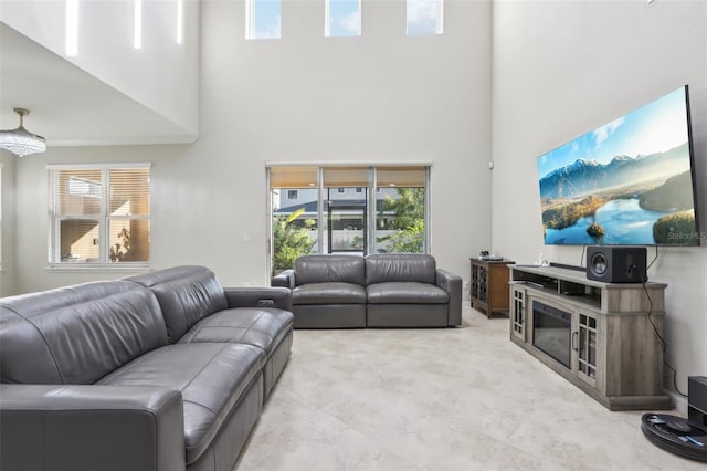 living room with a towering ceiling